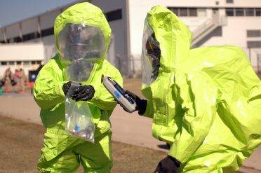 Soldiers participating in the toxic industrial chemical protection and detection equipment training, use a HazMat ID to identify chemical agents, Nov. 18, at Fort Hood, Texas. The handheld device uses a computerized sensor and diamond plate technology to detect the presence of a wide variety of chemical substances, from common household items to deadly industrial toxins.
