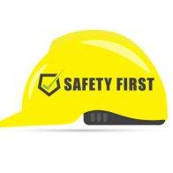 Safety first symbol with yellow helmet on white