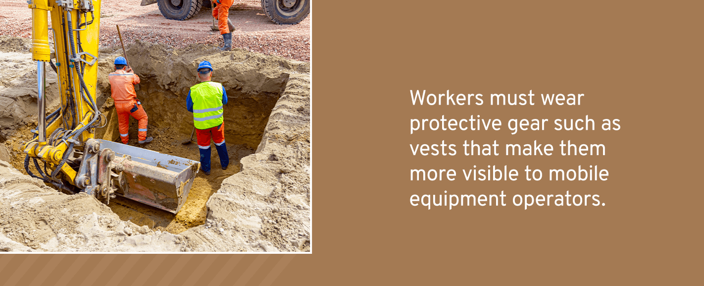 Workers must wear protective gear such as vests that make them more visible to mobile equipment operators. Hard hats will also protect them from hazards such as falling material.