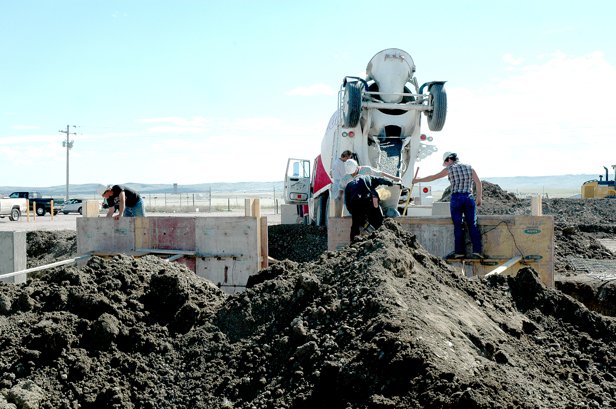 Contractors at Ellsworth Air Force Base, S.D., pour concrete at a propane air mix plant Sept. 29, 2006, in preparation for the installation of four new tanks, each capable of holding 60,000 gallons of propane.  The plant, completed in December 1998, was part of the first contract partnership between Ellsworth and Montana Dakota Utilities and today saves the base more than $1 million annually.  (U.S. Air Force photo/Airman 1st Class Kimberly Limrick)