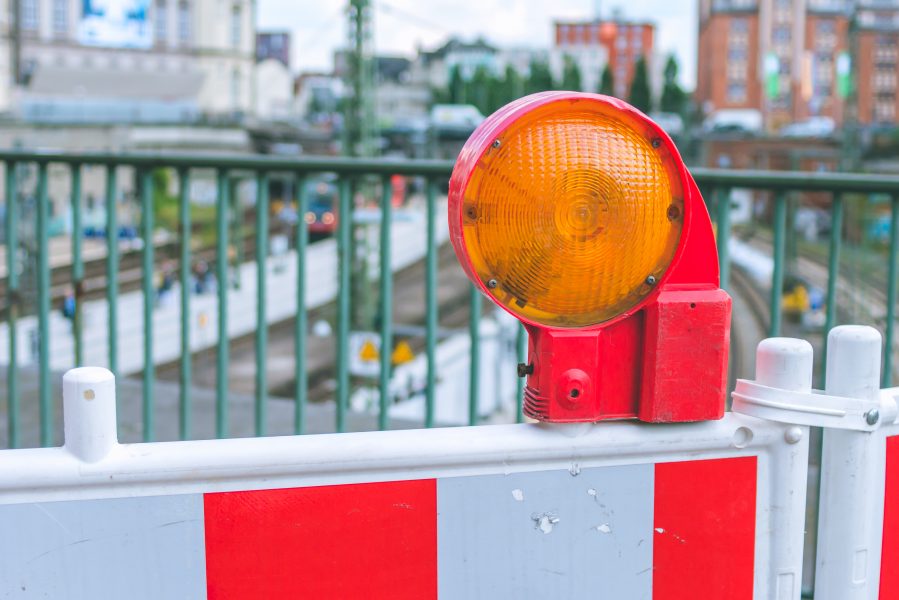 graphicstock-orange-construction-warning-street-barrier-light-on-barricade-road-construction-on-the-streets-of-european-cities-germany-hamburg_HwZYckXcOW-e1571923397469